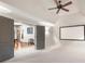 Bonus room featuring carpeted floors and a wall-mounted projector screen. A view to the game room is visible at 8340 Colonial Pl, Duluth, GA 30097