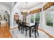 Elegant dining room with a chandelier, large windows, and classic decor, perfect for formal gatherings at 8340 Colonial Pl, Duluth, GA 30097