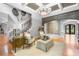 Inviting living room featuring elegant seating, a staircase, and a view into the front entrance at 8340 Colonial Pl, Duluth, GA 30097