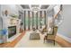 Spacious living room with fireplace, hardwood floors, and views of the backyard at 8340 Colonial Pl, Duluth, GA 30097