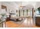 Spacious main bedroom with a coffered ceiling, sitting area, and large windows providing natural light at 8340 Colonial Pl, Duluth, GA 30097