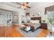 Luxurious main bedroom suite featuring a sitting area, coffered ceiling, and hardwood floors for added elegance at 8340 Colonial Pl, Duluth, GA 30097
