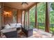 Covered patio with outdoor seating, a table with a fire pit, and a view of the backyard at 8340 Colonial Pl, Duluth, GA 30097