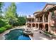 An expansive outdoor area features a swimming pool, hot tub, and lush landscaping at 8340 Colonial Pl, Duluth, GA 30097