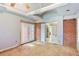 Living room with exposed brick accent wall, French doors and an entrance to a tiled kitchen at 2054 Fargo Se Pl, Atlanta, GA 30316