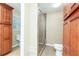 Bathroom with tiled shower, toilet, and built-in storage cabinets at 3112 Calumet Nw Cir, Kennesaw, GA 30152