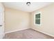 Neutral bedroom featuring carpet, natural light, and a spacious closet at 3112 Calumet Nw Cir, Kennesaw, GA 30152
