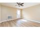 Bedroom features a ceiling fan, neutral walls, and wood-look laminate flooring at 3112 Calumet Nw Cir, Kennesaw, GA 30152