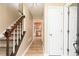 Inviting entryway with hardwood floors, staircase, and view into kitchen at 3112 Calumet Nw Cir, Kennesaw, GA 30152