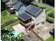 Exterior angle showcases a home with a deck, pool, solar panels and a fenced-in backyard at 3112 Calumet Nw Cir, Kennesaw, GA 30152