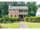 Charming brick home with a covered front porch and manicured landscaping at 3112 Calumet Nw Cir, Kennesaw, GA 30152