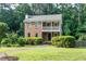 Charming brick home with a covered front porch and manicured landscaping at 3112 Calumet Nw Cir, Kennesaw, GA 30152