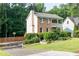 Home features a basketball court, manicured lawn, and a covered front porch at 3112 Calumet Nw Cir, Kennesaw, GA 30152