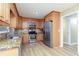 Spacious kitchen with stainless steel appliances and wood cabinets at 3112 Calumet Nw Cir, Kennesaw, GA 30152