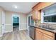 Bright kitchen with granite countertops and stainless steel dishwasher at 3112 Calumet Nw Cir, Kennesaw, GA 30152