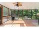 Relaxing screened porch with tile flooring overlooking the lush backyard and pool at 3112 Calumet Nw Cir, Kennesaw, GA 30152