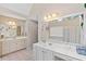 Bright bathroom featuring dual vanities, a soaking tub, and a separate shower with natural light at 405 Branch Forest Way, Stockbridge, GA 30281