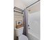 Cozy bathroom featuring a toilet and shower with grey curtain and neutral décor at 405 Branch Forest Way, Stockbridge, GA 30281