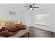 Cozy bedroom with a comfortable bed, modern decor, and natural light from the window at 405 Branch Forest Way, Stockbridge, GA 30281