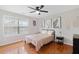 Cozy bedroom with natural light, modern decor, and hardwood floors at 405 Branch Forest Way, Stockbridge, GA 30281