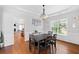 Elegant dining room with hardwood floors and modern lighting at 405 Branch Forest Way, Stockbridge, GA 30281