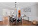 Dining room with hardwood floors, tray ceiling, and access to the kitchen at 405 Branch Forest Way, Stockbridge, GA 30281