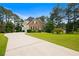Lovely two-story home featuring a long driveway and a large front yard at 405 Branch Forest Way, Stockbridge, GA 30281