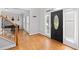 Inviting foyer with hardwood floors, natural light, and a view of the staircase at 405 Branch Forest Way, Stockbridge, GA 30281