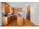 Updated kitchen with wood cabinetry, granite countertops, and stainless steel appliances at 405 Branch Forest Way, Stockbridge, GA 30281