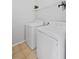 Well-lit laundry room featuring a washer and dryer at 405 Branch Forest Way, Stockbridge, GA 30281
