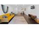 Spacious living room with hardwood floors, contemporary decor, and a view into the dining area at 405 Branch Forest Way, Stockbridge, GA 30281