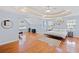 Spacious main bedroom with tray ceiling, hardwood floors, and bright natural light at 405 Branch Forest Way, Stockbridge, GA 30281