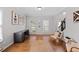 Bright home office with hardwood floors, neutral walls, and ample desk space at 405 Branch Forest Way, Stockbridge, GA 30281