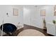 Cozy sitting area features wood floors, modern decor, and natural light, creating a peaceful retreat at 405 Branch Forest Way, Stockbridge, GA 30281