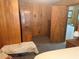 Bedroom with ample storage and wood-paneled walls at 871 Malcom Se St, Conyers, GA 30012