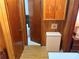 Hallway leads to the bathroom, with a storage cabinet and a laundry basket at 871 Malcom Se St, Conyers, GA 30012