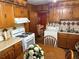 Cozy kitchen featuring classic wood cabinets, linoleum floors, and modern appliances at 871 Malcom Se St, Conyers, GA 30012