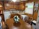 Eat-in kitchen with wood cabinetry, appliances, table, and a washer at 871 Malcom Se St, Conyers, GA 30012