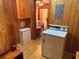 A dedicated laundry room features a washing machine and wood paneling at 871 Malcom Se St, Conyers, GA 30012