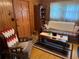 A cozy living room features a plaid couch and wooden coffee table with an armchair at 871 Malcom Se St, Conyers, GA 30012