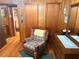 A sitting room has an armchair, a dresser with a mirror, and two closets at 871 Malcom Se St, Conyers, GA 30012