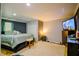 Comfortable bedroom with a TV, large bed, and ensuite bathroom at 1444 Elliotts Lane, Auburn, GA 30011