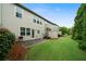 Spacious backyard featuring a patio, grill and a well-maintained lawn perfect for outdoor living at 1630 Marsanne Nw Ter # 27, Kennesaw, GA 30152