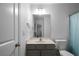 Neutral bathroom featuring a gray vanity, a toilet and a mirror at 1630 Marsanne Nw Ter # 27, Kennesaw, GA 30152