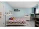 Charming bedroom features a cozy bed with superhero themed bedding and modern flooring at 1630 Marsanne Nw Ter # 27, Kennesaw, GA 30152