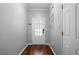 Inviting entryway with hardwood floors, a white front door with glass, and neutral wall paint at 1630 Marsanne Nw Ter # 27, Kennesaw, GA 30152