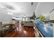 Spacious open-concept living area with hardwood floors and natural light, great for gatherings at 1630 Marsanne Nw Ter # 27, Kennesaw, GA 30152