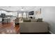Comfortable living space with hardwood floors, a fireplace, and open flow to the kitchen area at 1630 Marsanne Nw Ter # 27, Kennesaw, GA 30152