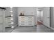 Main bedroom featuring an accent wall with dresser and adjacent walk in closet at 1630 Marsanne Nw Ter # 27, Kennesaw, GA 30152