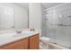 Bathroom featuring vanity with sink and glass enclosed shower at 4139 Magnolia Glen Walk, Norcross, GA 30093